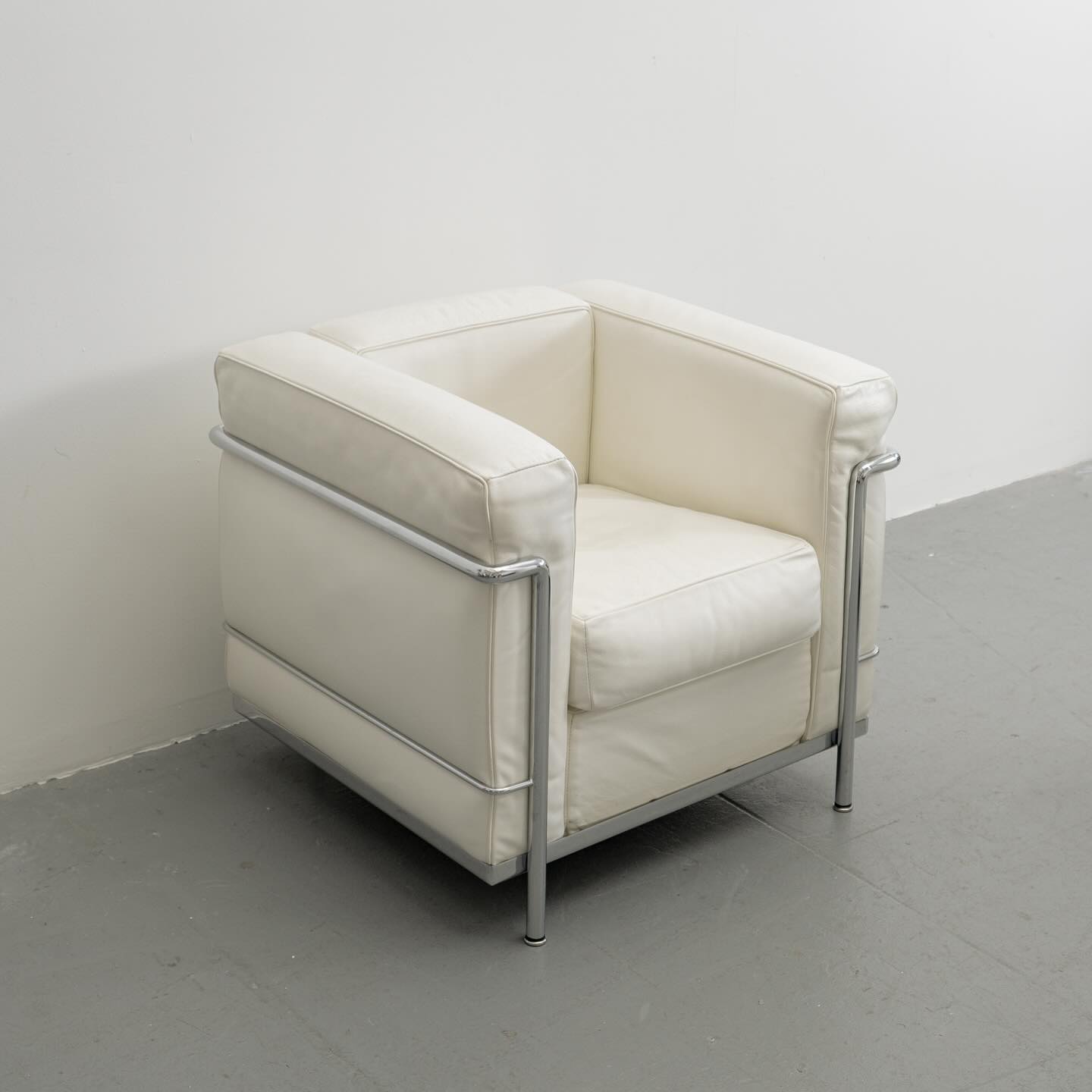 LC2 Petite Comfort in White Leather + Chrome by Le Corbusier, Charlotte Perriand and Pierre Jeanneret) for Cassina, signed + numbered